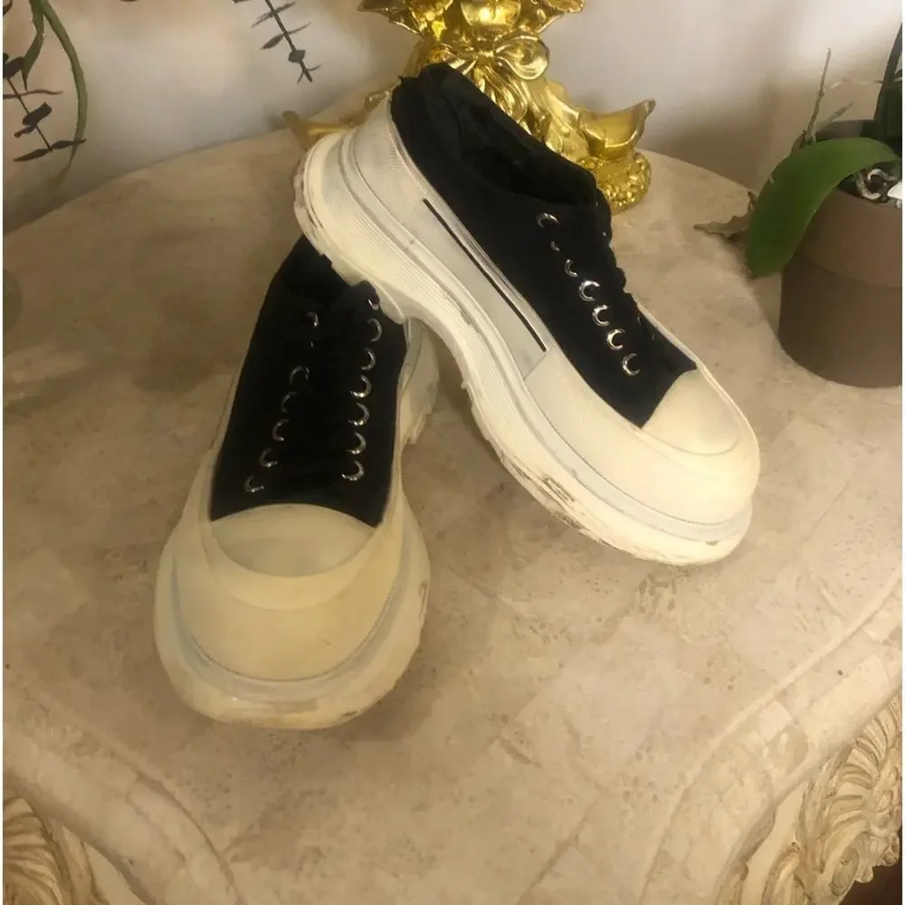 Alexander McQueen black and white platform chucks.